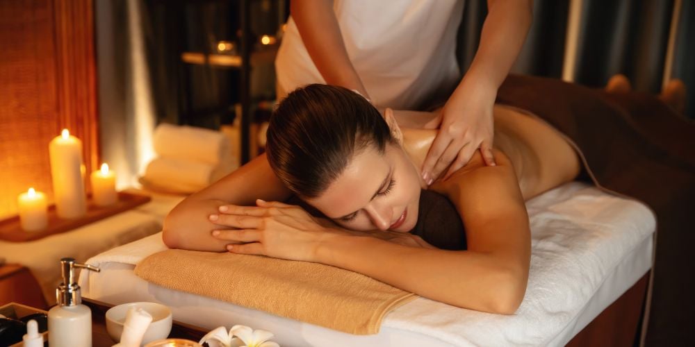 Woman receiving a massage at a massage studio.